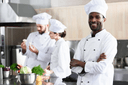 Chefs preparing service in a professional kitchen